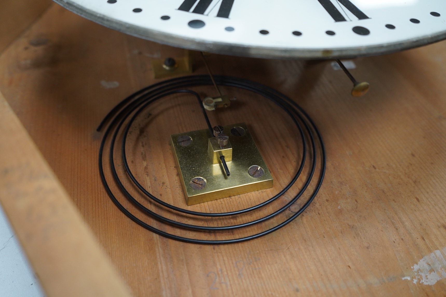 A French oak oval wall clock, the dial inscribed Any. Bailly A Lyon, with pendulum and key, 68cm high